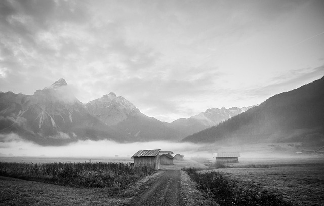 black SUV mountain road landscape